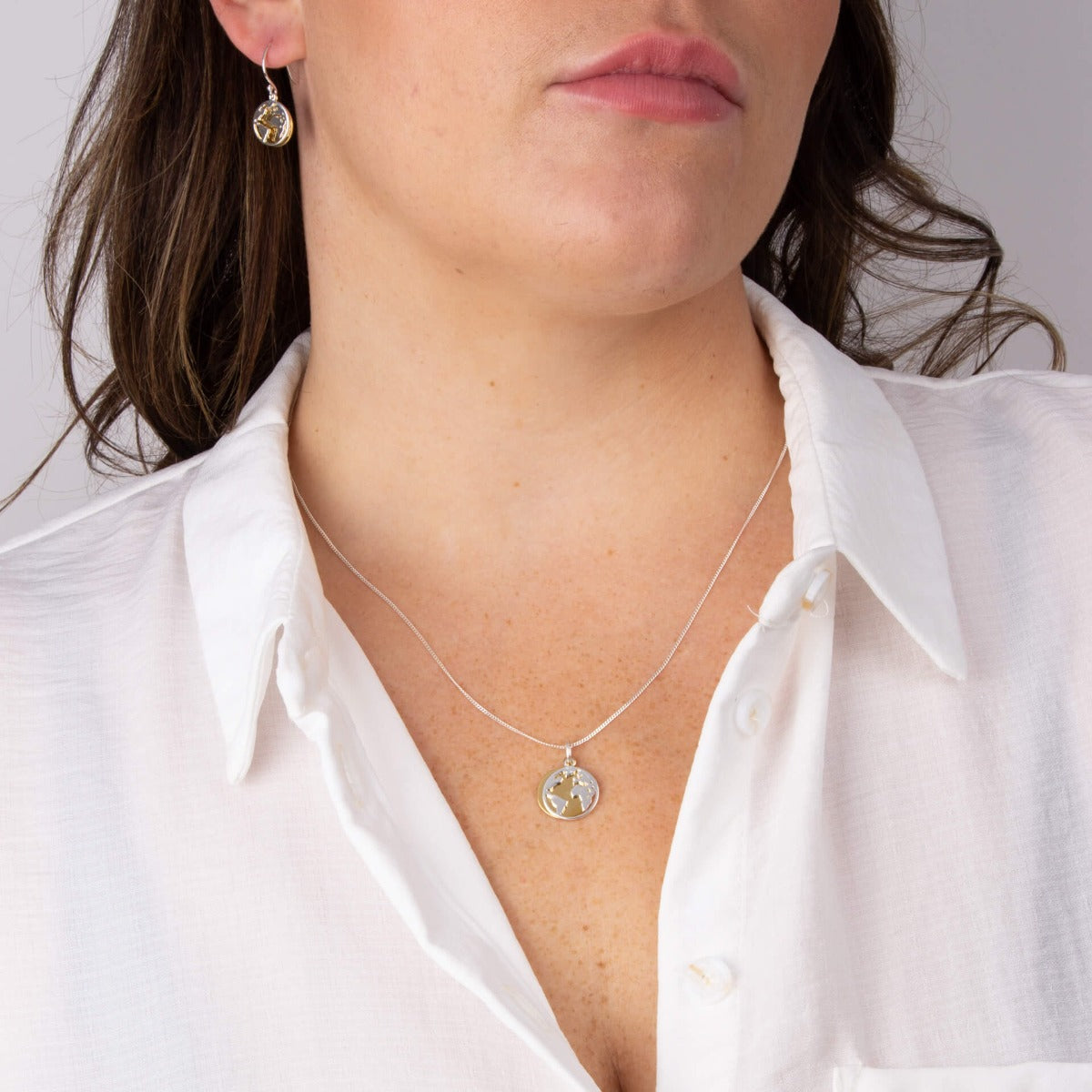 World Pendant with Yellow Gold Plated Disc