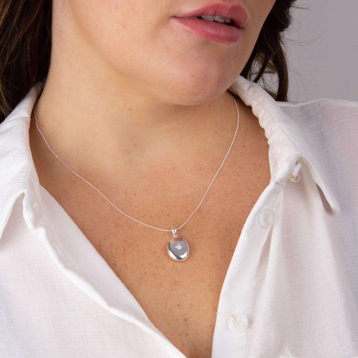 Oval Locket Pendant with Starburst Cubic Zirconia