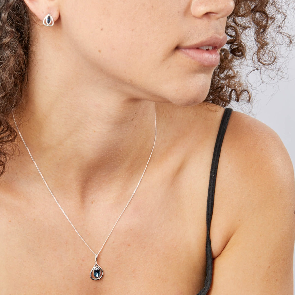 Open Teardrop Stud Earrings With Montana Blue Crystals