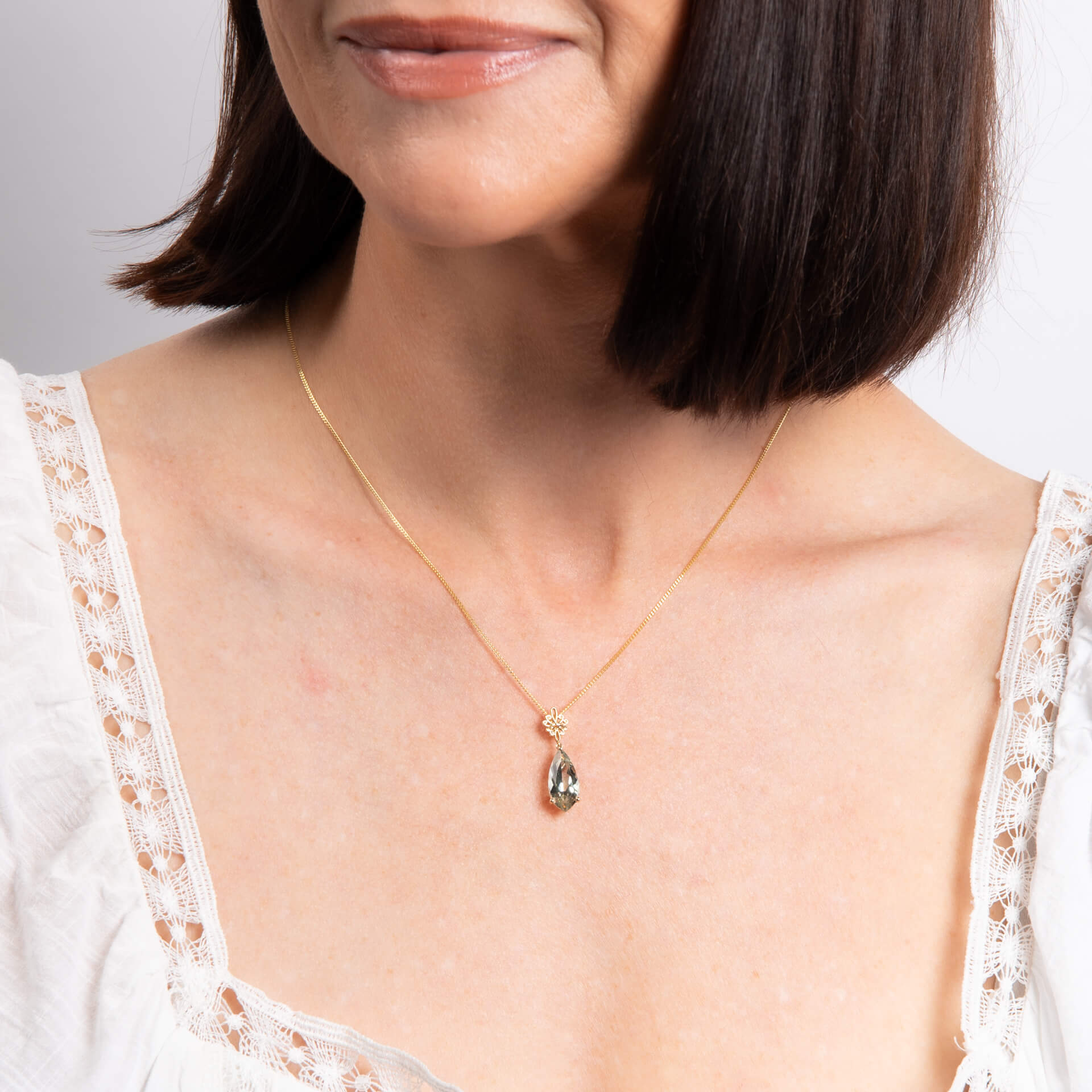 Fancy Cut Green Quartz Drop Pendant with Swirl Detail Bale